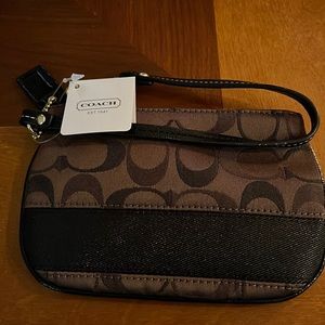Cute brown Coach wristlet! Never been used and tag still attached.